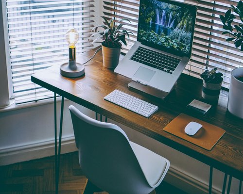 home workspace with water on the desk